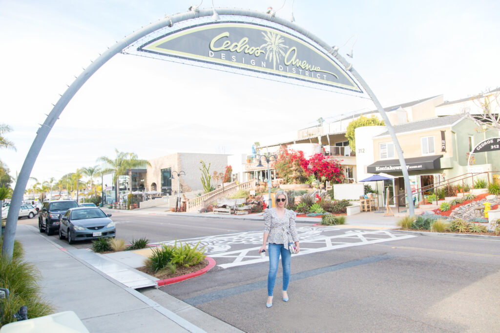 North County Solana Beach Personal Stylist Jaquelyn Wahidi stands in front of the Cedros Avenue sign.