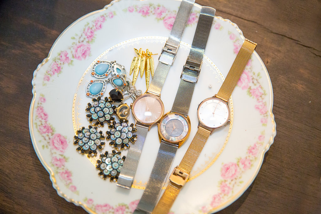 Jaquelyn Wahidi, Personal Stylist shows a collection of her client's jewelry on a vintage plate.