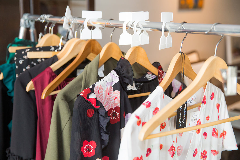 San Diego personal stylist Jaquelyn Wahidi shows a client's wardrobe on a folding rack.