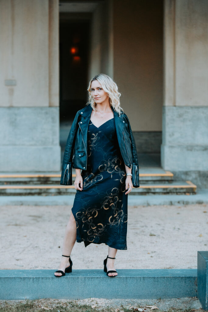 Jaquelyn Wahidi, fashion stylist in San Diego, wears a leather jacket over a slip dress.